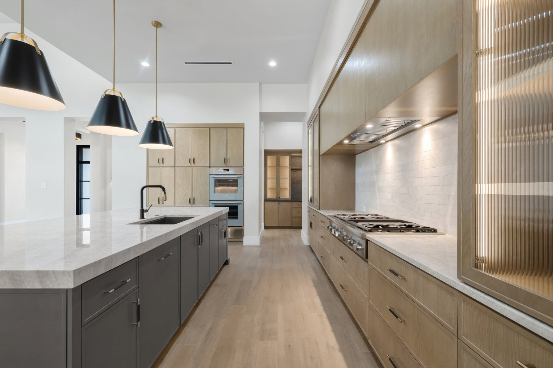 Light oak kitchen with large island by Amaya
